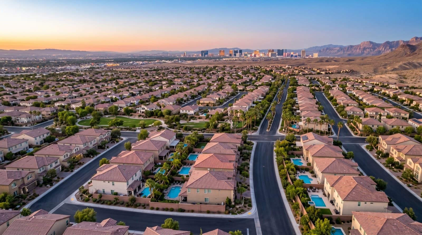 New construction homes in Skye Canyon and Tule Springs area, North Las Vegas, 2026 — residential aerial with Strip view