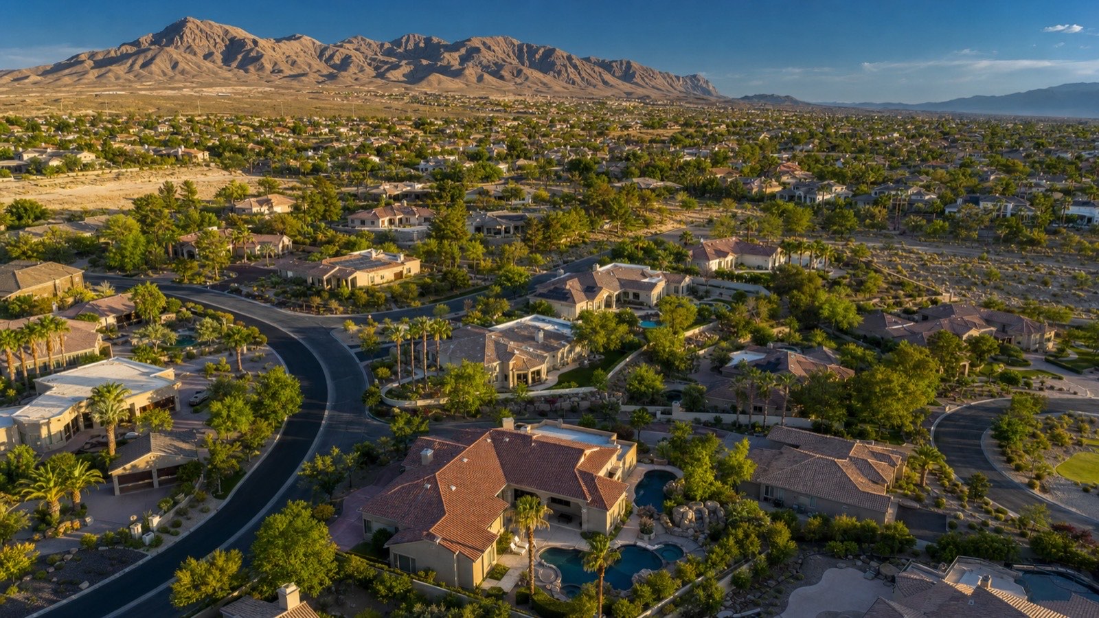 McCullough Range and Henderson hillside foothills at golden hour with Mediterranean luxury estates