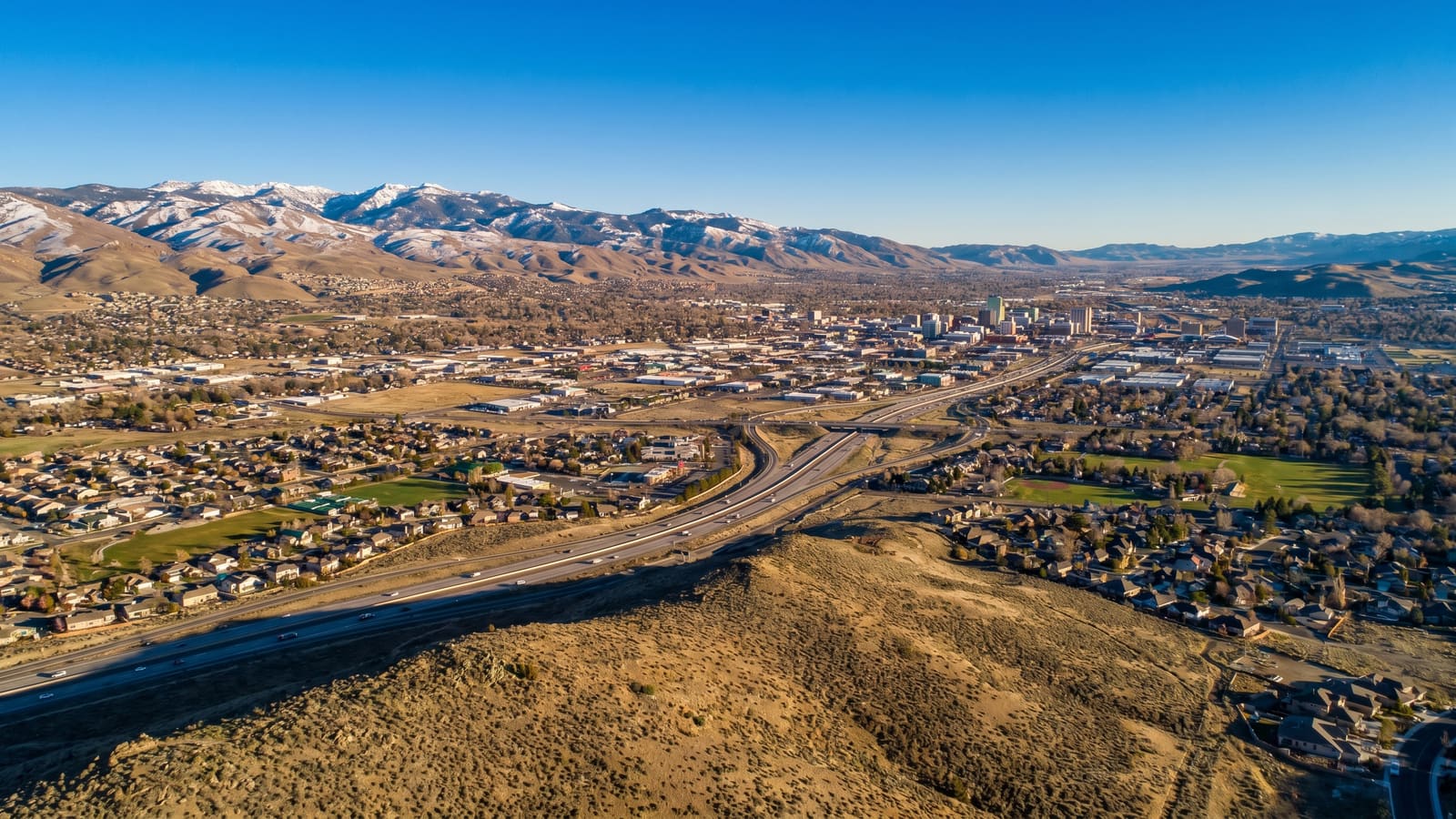 Reno-Sparks Truckee Meadows valley with neighborhoods spreading toward the Sierra Nevada mountains