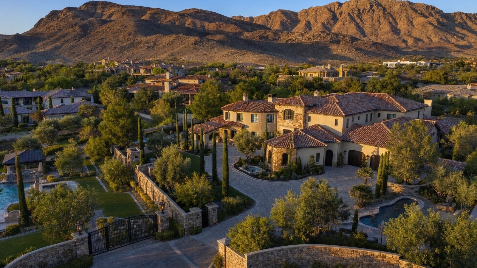 Roma Hills Henderson Italian-themed Tuscan luxury estate streetscape with mature palms and hillside grade