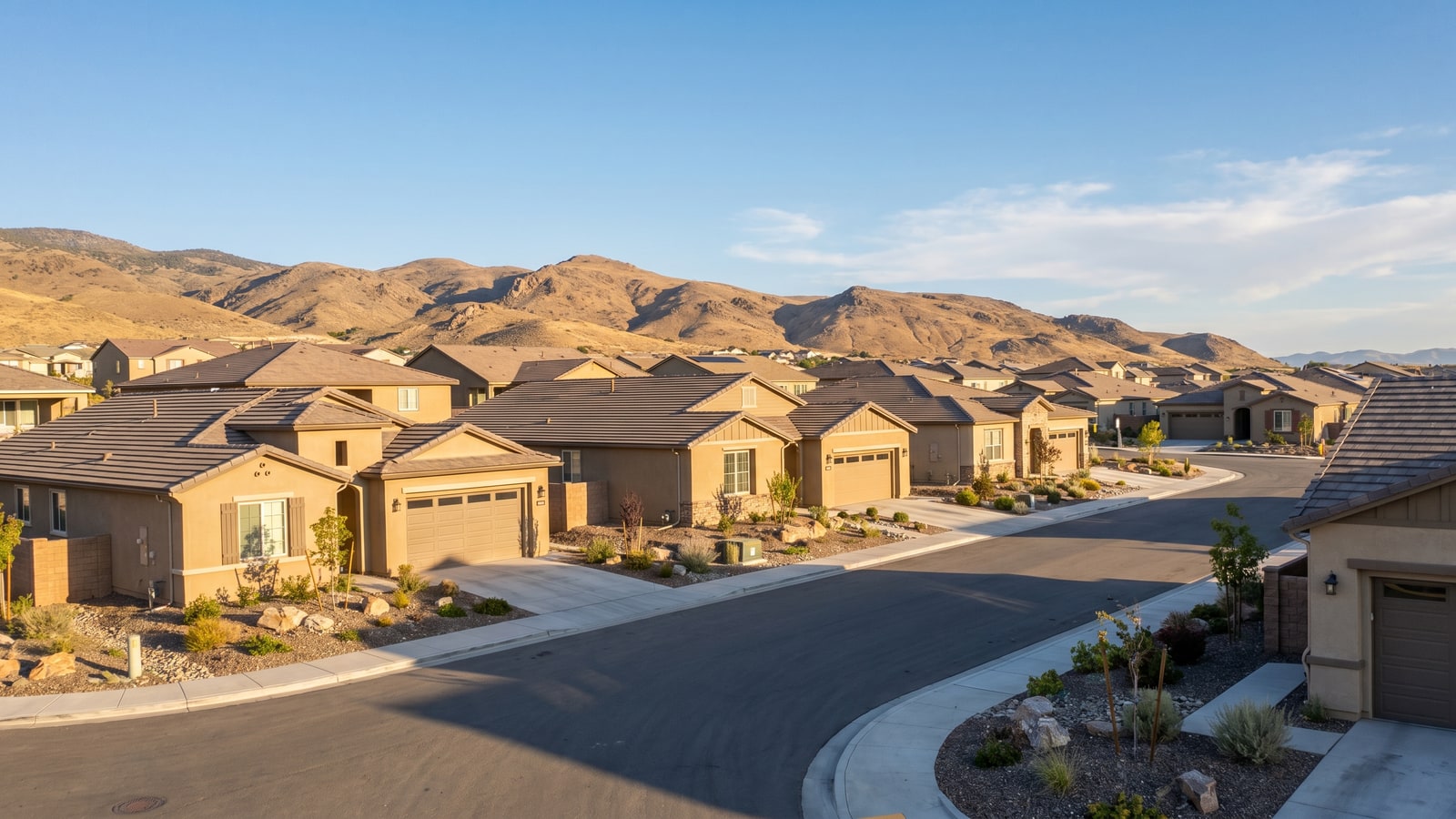 Typical Spanish Springs neighborhood in Sparks Nevada with newer single-family homes and mountains behind